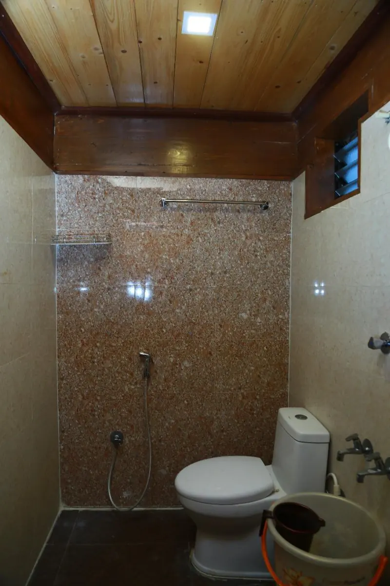 Tiled bathroom with shower fitting