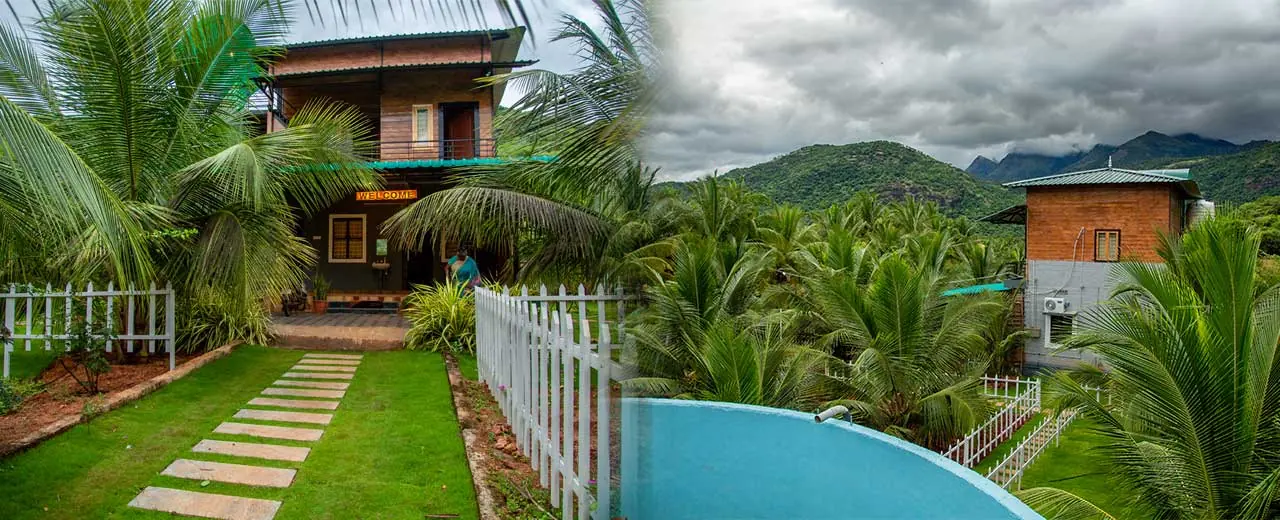 The farmhouse at Jungle Valley Farms with the lawn path and the hills of the Cumbum Valley behind